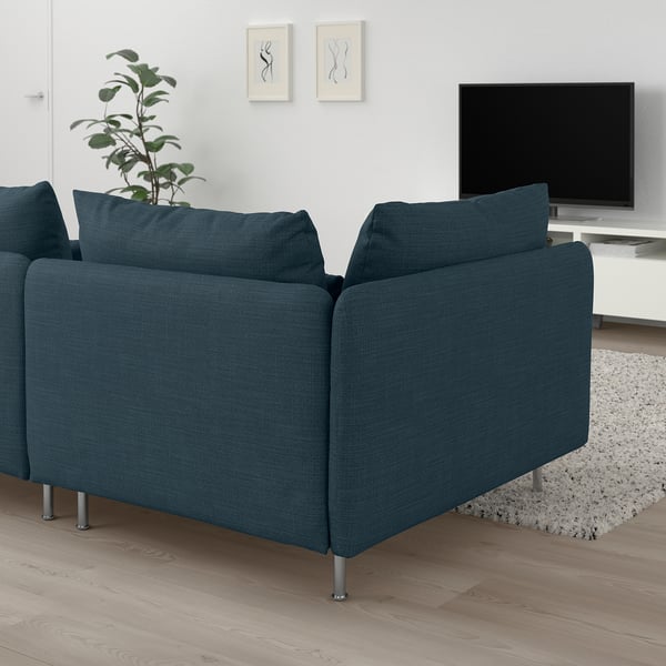 Blue SÖDERHAMN sectional sofa with metal frame, huge cushions, tv, plant, and light floors.