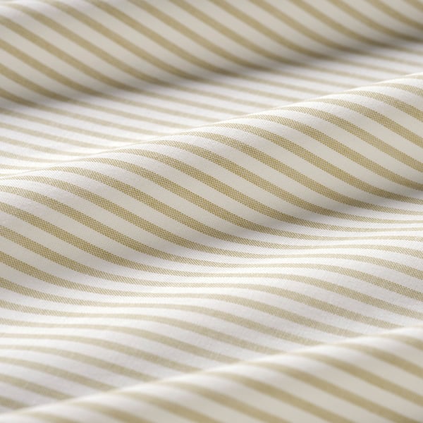 Close-up of texture on striped beige and white fabric, showcasing its quality and pattern.