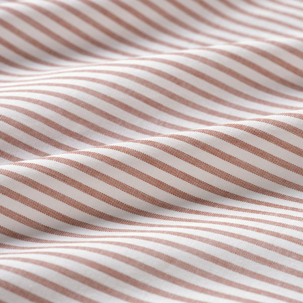 Close-up of striped fabric, showcasing high-quality cotton texture and stitching.