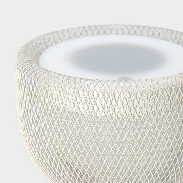 Modern white mesh-covered speaker, sleek, quality design.