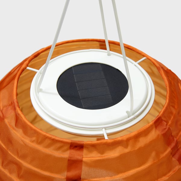 A stylish solar-powered pendant light with a vibrant shade made from recycled material.