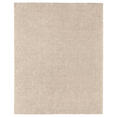A beige STOENSE rug. Its rectangular, made of polypropylene with a soft, low pile. Ideal for various floors, it dampens sound and is easy to care for.