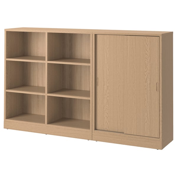 Light oak bookshelf with sliding doors & open shelves, blending modern & classic design.