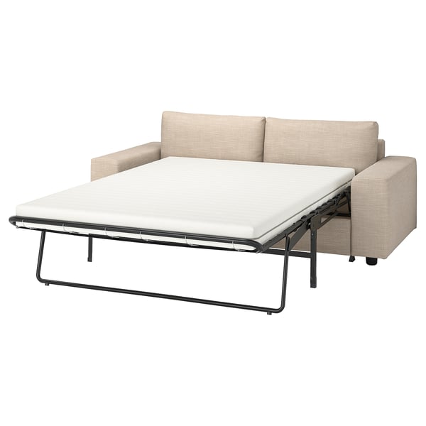 VIMLE sofa-bed in beige, fabric cover, convertible l-shape with cushions removed for sleeping.
