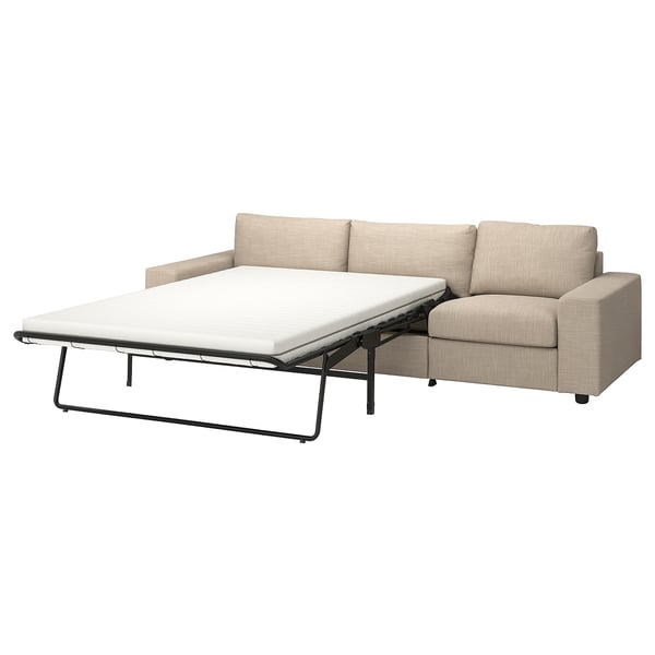 A beige VIMLE sofa-bed with a thick mattress, combining comfort and functionality in a modern design.
