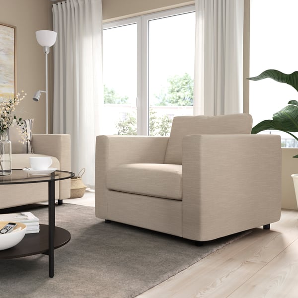 Modern living room with large VIMLE beige sofa, sleek coffee table, and tall windows. Sofas size dominates the room.