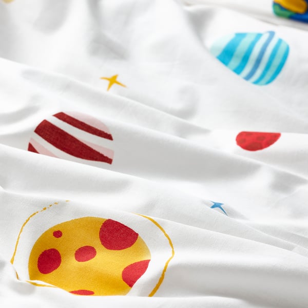 Vibrant, high-quality bedding, showcasing colourful planets, moons, and stars on a crisp white background.