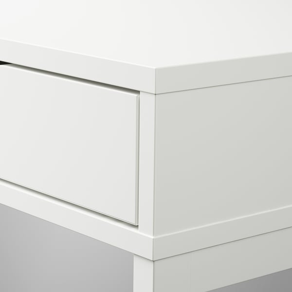 Modern white desk with sleek, minimalist design and drawers.