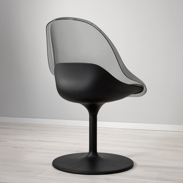 Modern chair with sleek black seat, contoured grey back, and swivel base on light wood floor.