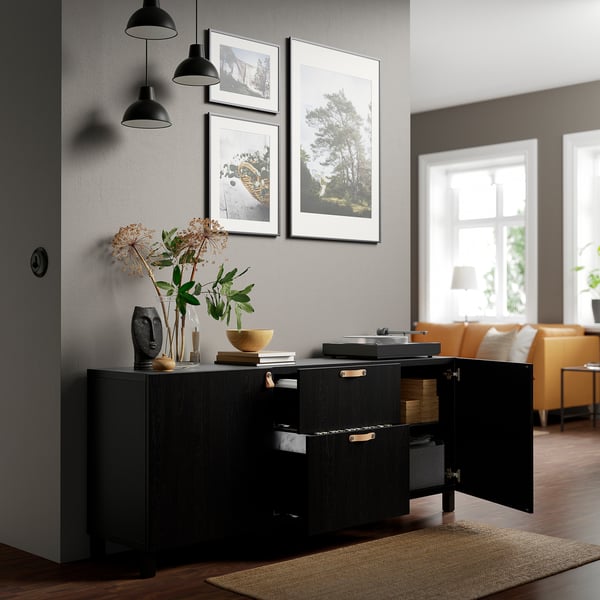Modern living room with BESTÅ sideboard, adjustable storage, and decor.