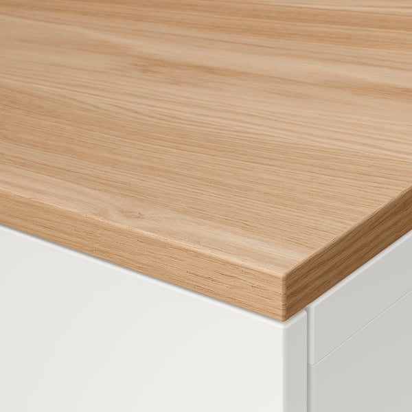 Close-up of smooth, light wooden tabletop, part of modern furniture, showcasing natural oak finish and quality craftsmanship.