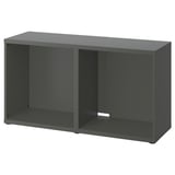 An ikea BESTÅ tv bench in dark grey. It is rectangular, measuring 50x120 cm, with an open space and adjustable feet for stability.