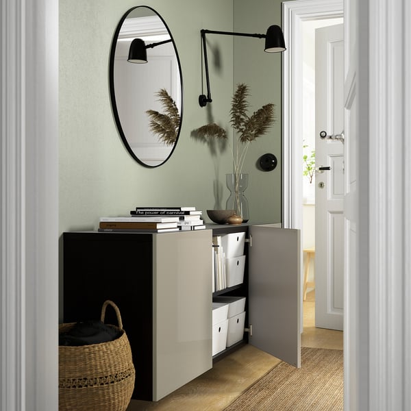 Modern entryway with BESTÅ storage, mirror, lights.