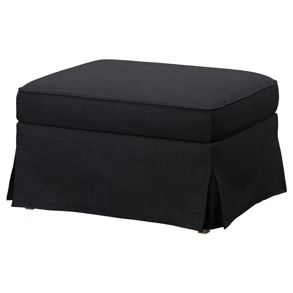 Dark grey EKTORP footstool, rectangular with ruffled edges, soft cushioned top.