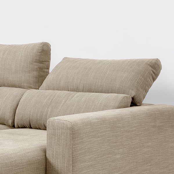 It shows a cushioned sofa with an adjustable headrest, designed for comfort and support.