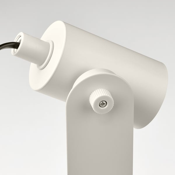 Modern white desk lamp with adjustable light, showing quality design and materials.