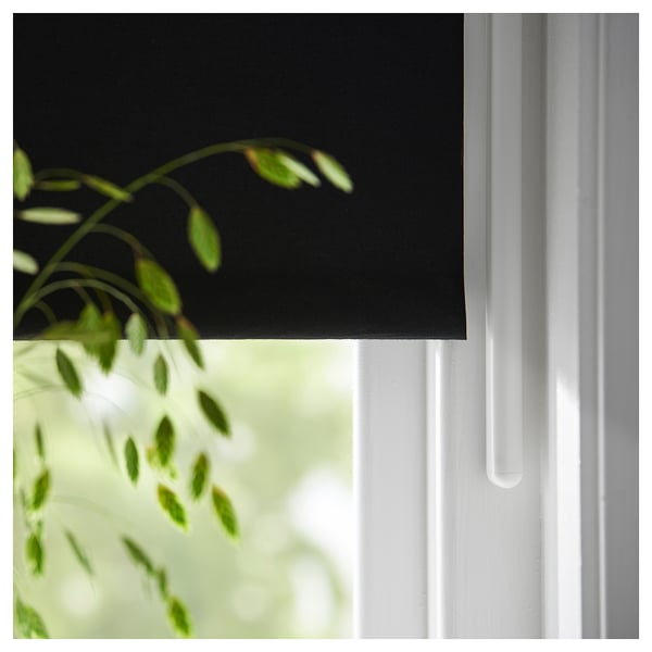 FRIDANS roller blind with green leaves, partially closed for light & privacy, eco-friendly recycled polyester.