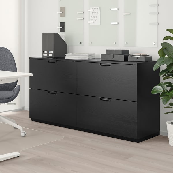GALANT black wooden storage unit, modern office, fits under whiteboards, holds files, boxes, chair nearby.
