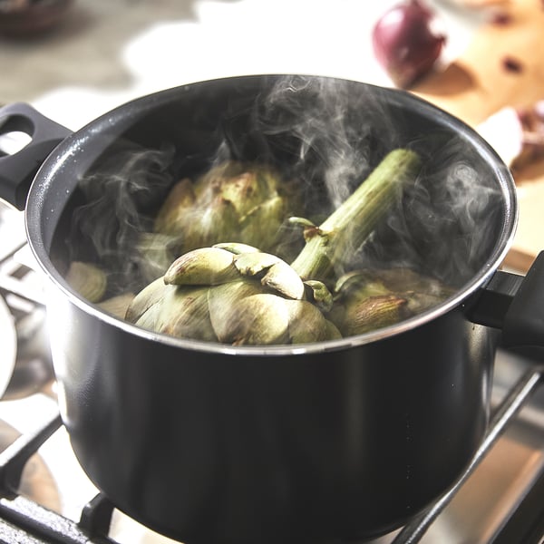 Boiling artichokes, steam rising.