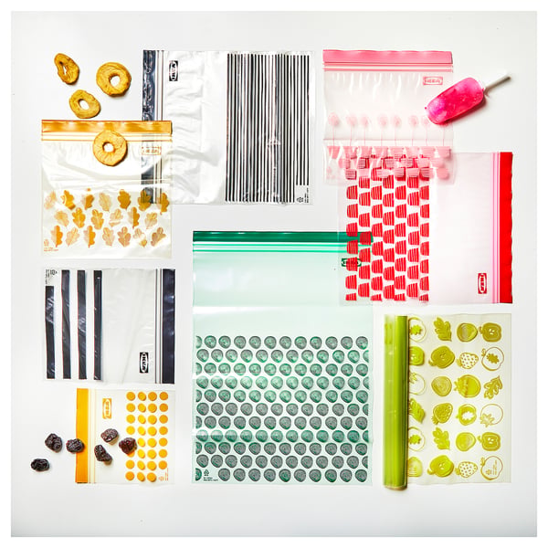 Various colorful resealable plastic bags, containing candies, stickers, and items; some bags are transparent.
