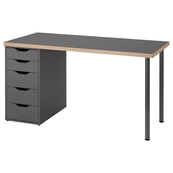 Modern grey desk with four drawers, sleek handles, and metal legs. Design a mix of grey and wood tones, ideal for a home office.