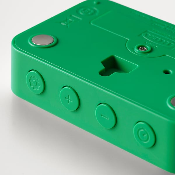 Bright green digital clock with round buttons, magnet for fridge attachment.