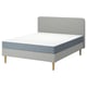 Modern bed in light grey with white mattress, wooden legs, flat slats, and soft headboard.