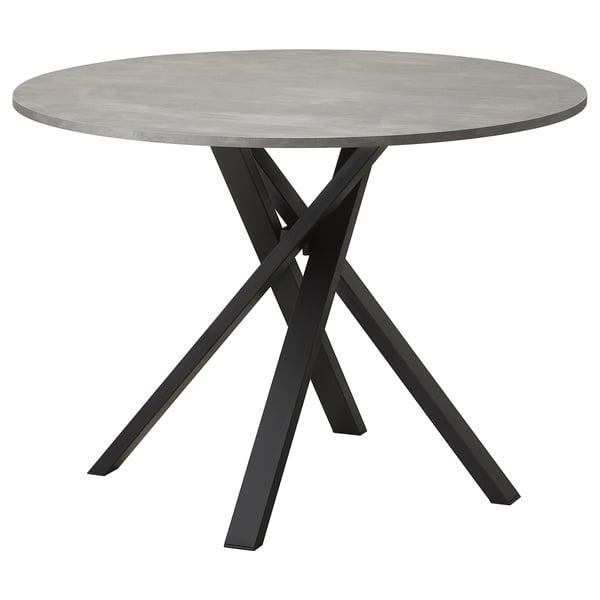 Modern round dining table with grey concrete top and black metal criss-cross legs.