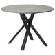 Modern round dining table with grey concrete top and black metal criss-cross legs.