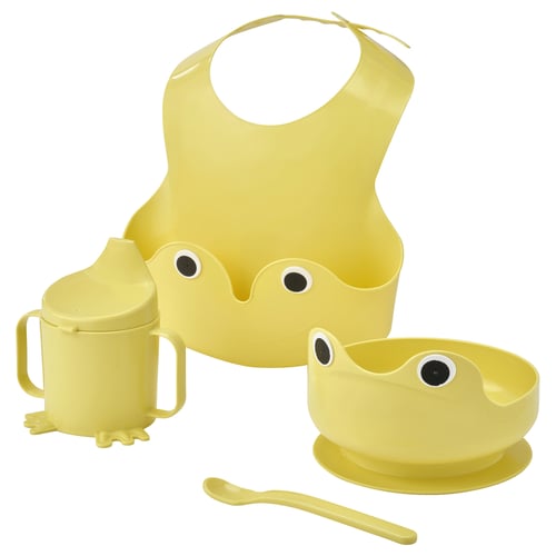 Yellow baby feeding set: bib, cup, bowl, spoon. Playful, functional design.