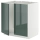 An ikea METOD kitchen cabinet with glossy grey-green doors and a white frame in a modern design.
