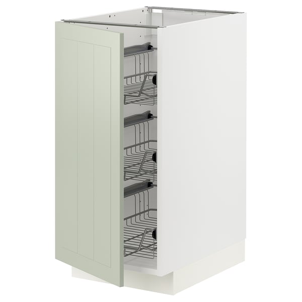 A METOD kitchen cabinet in green with organized interior shelves.