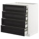 A white METOD kitchen unit with four black stained ash drawers featuring bevelled edges.