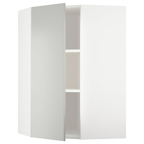 White corner cabinet, part of ikeas METOD kitchen system, featuring light grey havstorp fronts with a sleek, modern design.