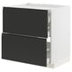METOD kitchen unit: modern black drawers, two high, white sides, sleek handle-less design.