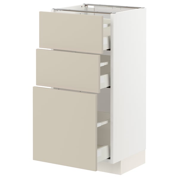 METOD kitchen unit in beige with white drawers and frame, modern design.