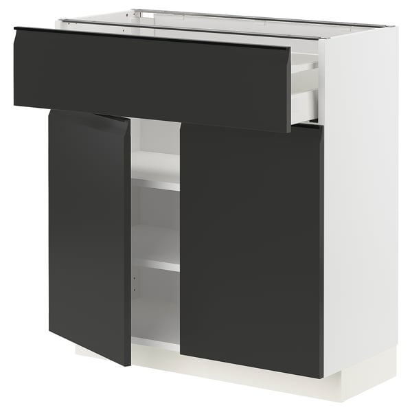 Modern black and white kitchen cabinet with drawers and shelves. Sleek design with smooth drawer fronts.