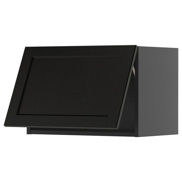 Black kitchen cabinet with beveled edges, sleek design.