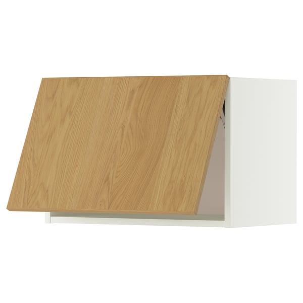An IKEA METOD kitchen cabinet with a light wooden door, featuring a white frame and clean, modern design.