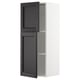 White METOD kitchen cabinet with black doors, one open.