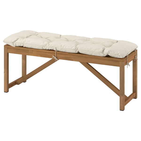 NÄMMARÖ outdoor bench with white cushion, acacia wood, rectangular, simple design.