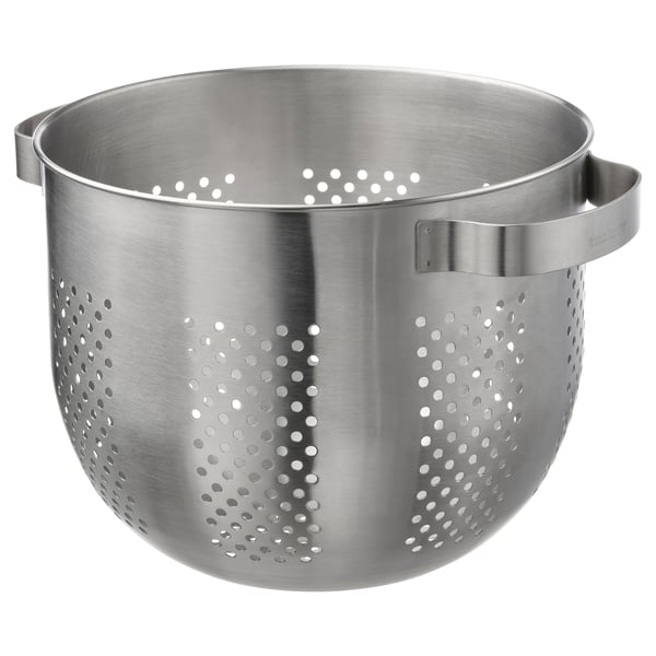 A silver stainless steel colander with two handles. It has circular holes for draining and is designed for food preparation.