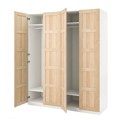Light wooden ikea PAX wardrobe with doors open, revealing interior shelves.