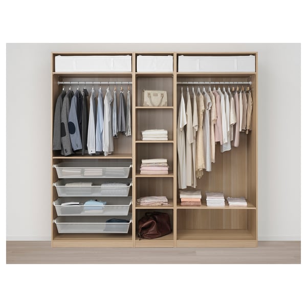 Organised wardrobe with clothes, shelves, and storage bins.