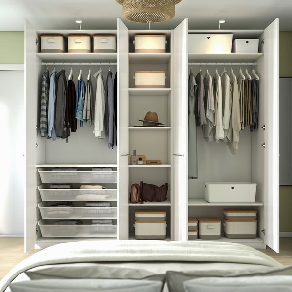 Open wardrobe with hangers, folded clothes, storage bins, and shelves. Integrated lighting, adjustable shelves, and hanging space.