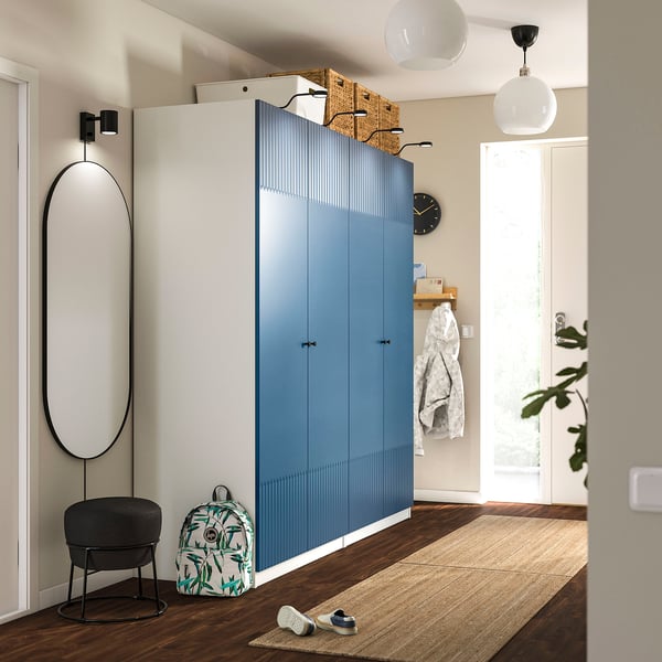 Modern blue PAX wardrobe with sleek handles and ample storage