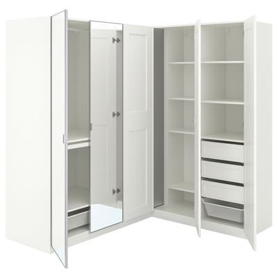 White PAX corner wardrobe with mirrored and open sections, multiple shelves, and organisers for efficient storage.