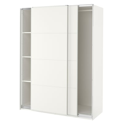 A white ikea PAX wardrobe with sliding doors. It stands tall with a minimalist design, featuring three shelves on each side for storage.
