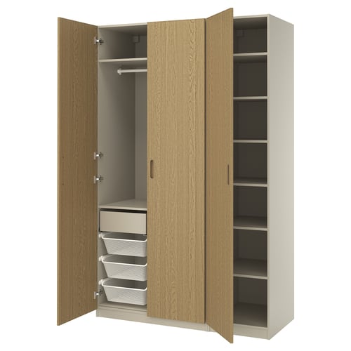 PAX wardrobe in light wood with mesh baskets, drawers, and adjustable shelves. Showing open doors, space-saving design.