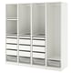 An ikea PAX white wardrobe, featuring both shelves and drawers for storage.